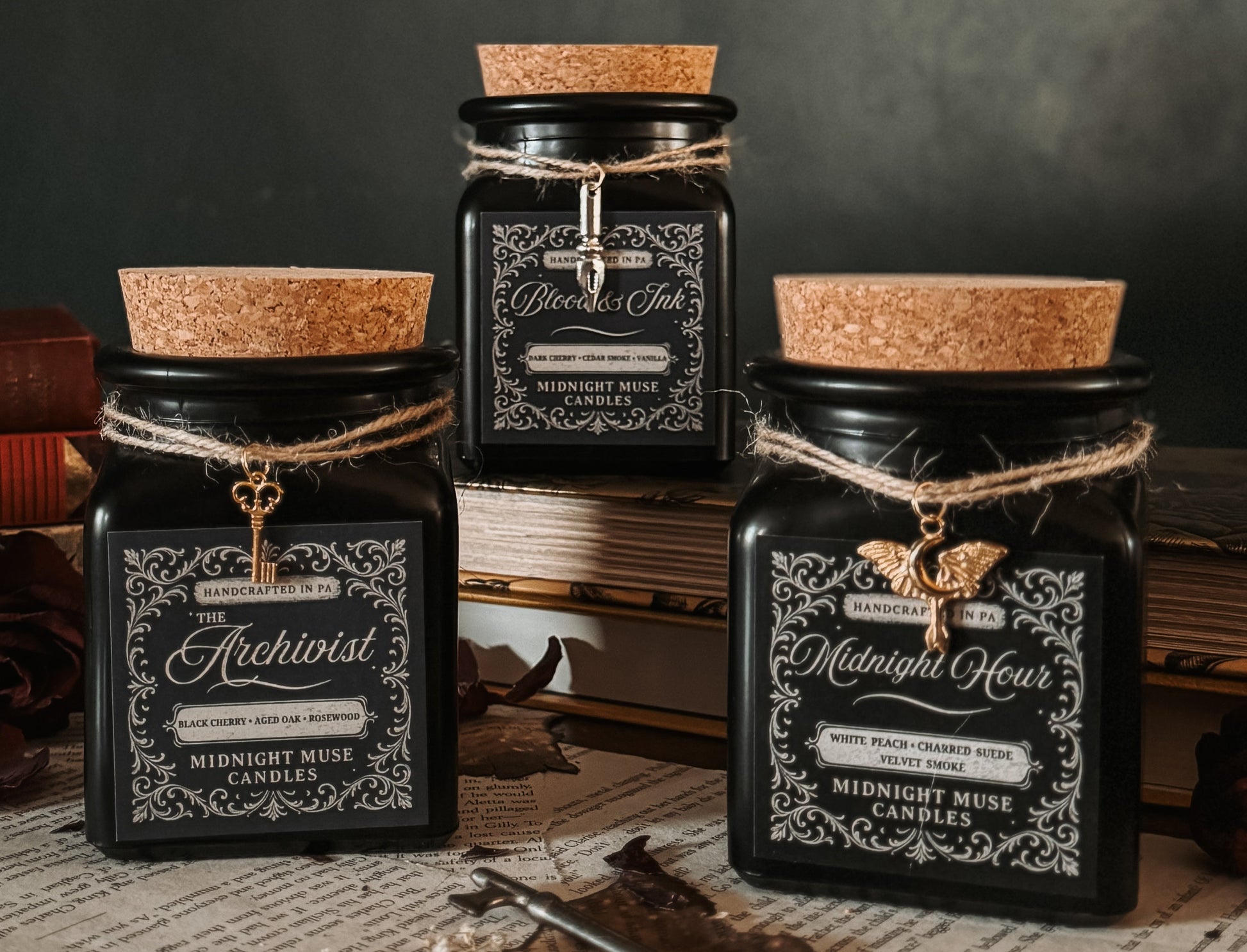 Set of black jars with cork lids on a dark background